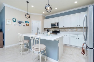 This home offers an ideal blend of modern comfort and elegant on Heron Creek Golf and Country Club in Florida - for sale on GolfHomes.com, golf home, golf lot