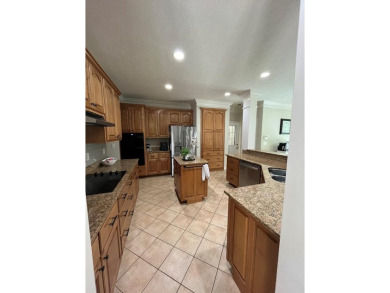 This beautiful brick home is nestled along the 14th hole of on Indian Trace Golf Course in Georgia - for sale on GolfHomes.com, golf home, golf lot
