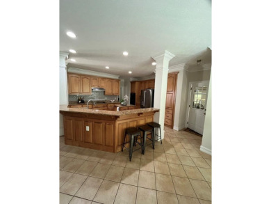 This beautiful brick home is nestled along the 14th hole of on Indian Trace Golf Course in Georgia - for sale on GolfHomes.com, golf home, golf lot