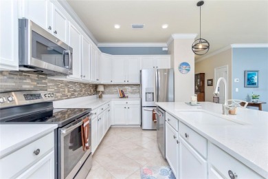 This home offers an ideal blend of modern comfort and elegant on Heron Creek Golf and Country Club in Florida - for sale on GolfHomes.com, golf home, golf lot