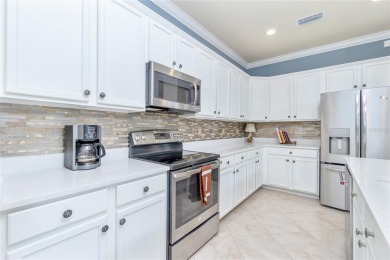This home offers an ideal blend of modern comfort and elegant on Heron Creek Golf and Country Club in Florida - for sale on GolfHomes.com, golf home, golf lot