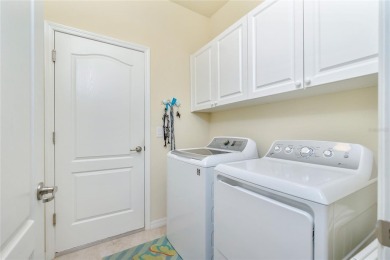 This home offers an ideal blend of modern comfort and elegant on Heron Creek Golf and Country Club in Florida - for sale on GolfHomes.com, golf home, golf lot