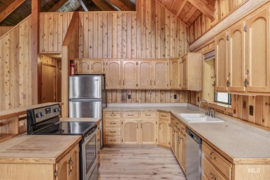 Custom, two-level True log cabin in the desirable Golf Course on Meadowcreek Golf Resort in Idaho - for sale on GolfHomes.com, golf home, golf lot