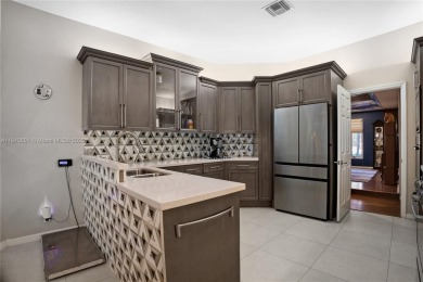Welcome to this 5BR/4BA custom home on a quiet cul-de-sac with on Jacaranda Golf Club in Florida - for sale on GolfHomes.com, golf home, golf lot