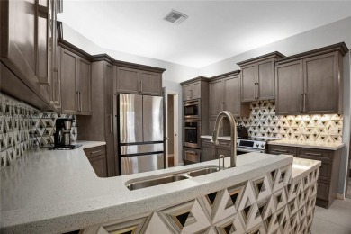 Welcome to this 5BR/4BA custom home on a quiet cul-de-sac with on Jacaranda Golf Club in Florida - for sale on GolfHomes.com, golf home, golf lot