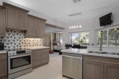 Welcome to this 5BR/4BA custom home on a quiet cul-de-sac with on Jacaranda Golf Club in Florida - for sale on GolfHomes.com, golf home, golf lot