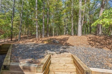 Home and 4 additional lots in Tranquil Lake Arrowhead Retreat on The Highlands Course at Lake Arrowhead in Georgia - for sale on GolfHomes.com, golf home, golf lot