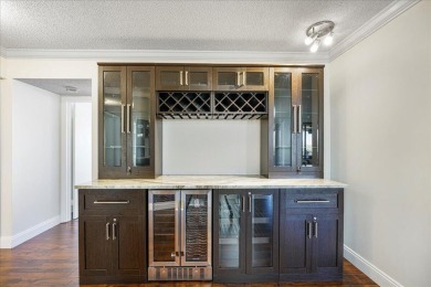 Freshly Painted, Laminate Floors Built-in Bar. Kitchen with on Boca Pointe Country Club in Florida - for sale on GolfHomes.com, golf home, golf lot