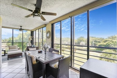 Freshly Painted, Laminate Floors Built-in Bar. Kitchen with on Boca Pointe Country Club in Florida - for sale on GolfHomes.com, golf home, golf lot
