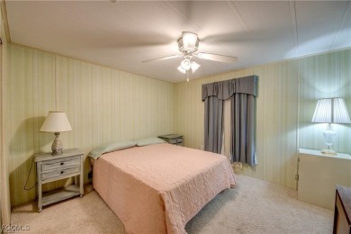 Remodeled with a new roof, new garage for golf cart, and a on Lake Fairways Country Club in Florida - for sale on GolfHomes.com, golf home, golf lot