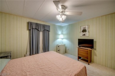 Remodeled with a new roof, new garage for golf cart, and a on Lake Fairways Country Club in Florida - for sale on GolfHomes.com, golf home, golf lot