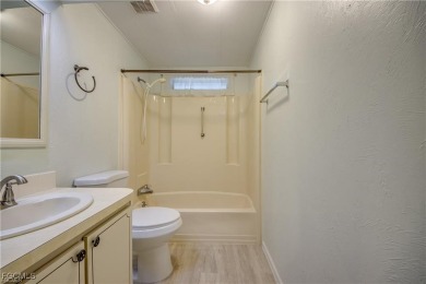 Remodeled with a new roof, new garage for golf cart, and a on Lake Fairways Country Club in Florida - for sale on GolfHomes.com, golf home, golf lot