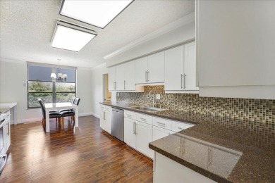 Freshly Painted, Laminate Floors Built-in Bar. Kitchen with on Boca Pointe Country Club in Florida - for sale on GolfHomes.com, golf home, golf lot