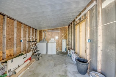 Remodeled with a new roof, new garage for golf cart, and a on Lake Fairways Country Club in Florida - for sale on GolfHomes.com, golf home, golf lot