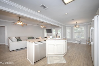 WELCOME HOME! This beautiful well maintained home sits on a on Diamondhead Country Club in Mississippi - for sale on GolfHomes.com, golf home, golf lot