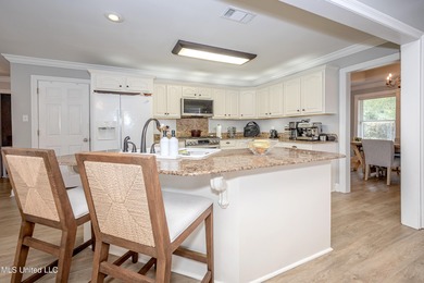 WELCOME HOME! This beautiful well maintained home sits on a on Diamondhead Country Club in Mississippi - for sale on GolfHomes.com, golf home, golf lot