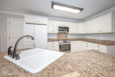 WELCOME HOME! This beautiful well maintained home sits on a on Diamondhead Country Club in Mississippi - for sale on GolfHomes.com, golf home, golf lot