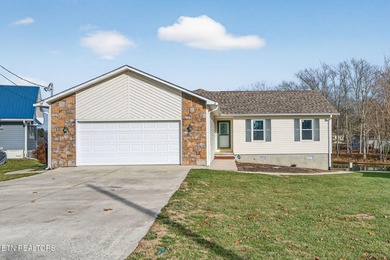 Wake up to shimmering water views and spend your evenings on Lake Tansi Village Country Club in Tennessee - for sale on GolfHomes.com, golf home, golf lot