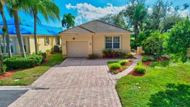 Nestled on a spectacular private tropically landscaped lot with on Gleneagles Golf and Country Club in Florida - for sale on GolfHomes.com, golf home, golf lot