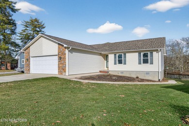 Wake up to shimmering water views and spend your evenings on Lake Tansi Village Country Club in Tennessee - for sale on GolfHomes.com, golf home, golf lot