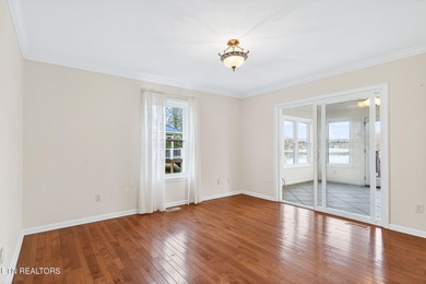 Wake up to shimmering water views and spend your evenings on Lake Tansi Village Country Club in Tennessee - for sale on GolfHomes.com, golf home, golf lot