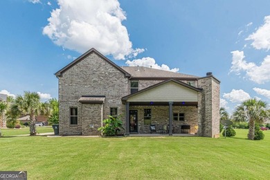 Discover this beautifully designed 4-sided brick home tucked on Crystal Lake Golf and Country Club in Georgia - for sale on GolfHomes.com, golf home, golf lot