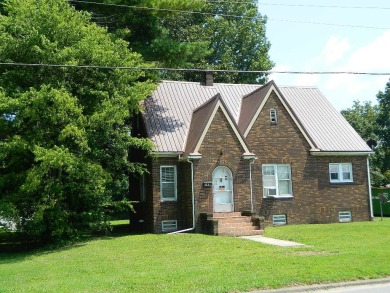 HUGE PRICE REDUCTION!  MOTIVATED SELLER!  A charming Brick Tudor on Fairfield Country Club in Illinois - for sale on GolfHomes.com, golf home, golf lot