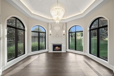 Set on over two acres along the coveted shores of all-sports on Orchard Lake Country Club in Michigan - for sale on GolfHomes.com, golf home, golf lot