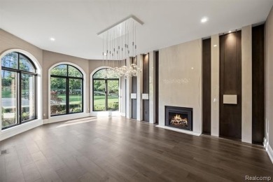 Set on over two acres along the coveted shores of all-sports on Orchard Lake Country Club in Michigan - for sale on GolfHomes.com, golf home, golf lot