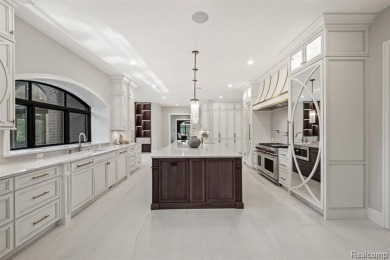 Set on over two acres along the coveted shores of all-sports on Orchard Lake Country Club in Michigan - for sale on GolfHomes.com, golf home, golf lot