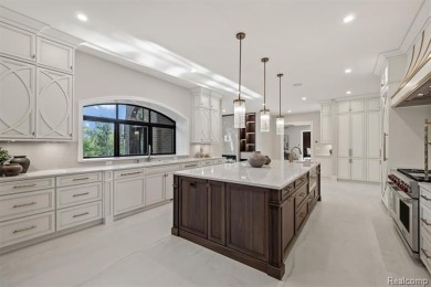 Set on over two acres along the coveted shores of all-sports on Orchard Lake Country Club in Michigan - for sale on GolfHomes.com, golf home, golf lot