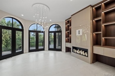 Set on over two acres along the coveted shores of all-sports on Orchard Lake Country Club in Michigan - for sale on GolfHomes.com, golf home, golf lot