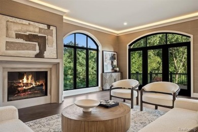 Set on over two acres along the coveted shores of all-sports on Orchard Lake Country Club in Michigan - for sale on GolfHomes.com, golf home, golf lot