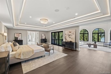 Set on over two acres along the coveted shores of all-sports on Orchard Lake Country Club in Michigan - for sale on GolfHomes.com, golf home, golf lot