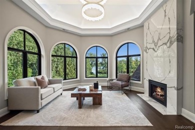 Set on over two acres along the coveted shores of all-sports on Orchard Lake Country Club in Michigan - for sale on GolfHomes.com, golf home, golf lot