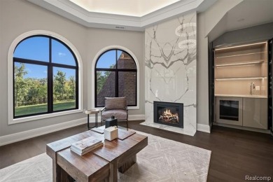 Set on over two acres along the coveted shores of all-sports on Orchard Lake Country Club in Michigan - for sale on GolfHomes.com, golf home, golf lot