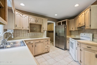 Opportunity awaits on the 7th tee! This spacious home in the on Olde Point Golf and Country Club in North Carolina - for sale on GolfHomes.com, golf home, golf lot