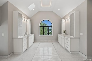 Set on over two acres along the coveted shores of all-sports on Orchard Lake Country Club in Michigan - for sale on GolfHomes.com, golf home, golf lot