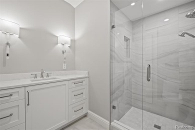 Set on over two acres along the coveted shores of all-sports on Orchard Lake Country Club in Michigan - for sale on GolfHomes.com, golf home, golf lot
