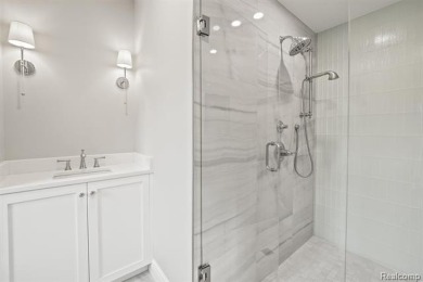 Set on over two acres along the coveted shores of all-sports on Orchard Lake Country Club in Michigan - for sale on GolfHomes.com, golf home, golf lot