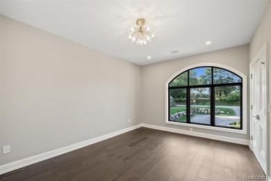 Set on over two acres along the coveted shores of all-sports on Orchard Lake Country Club in Michigan - for sale on GolfHomes.com, golf home, golf lot