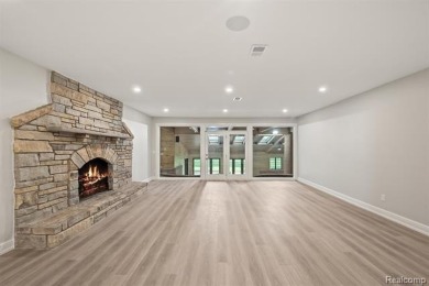 Set on over two acres along the coveted shores of all-sports on Orchard Lake Country Club in Michigan - for sale on GolfHomes.com, golf home, golf lot