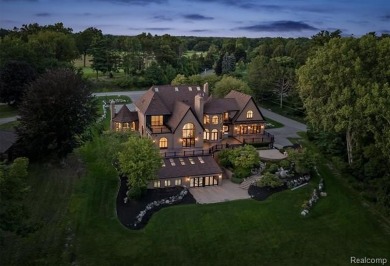 Set on over two acres along the coveted shores of all-sports on Orchard Lake Country Club in Michigan - for sale on GolfHomes.com, golf home, golf lot