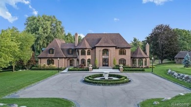 Set on over two acres along the coveted shores of all-sports on Orchard Lake Country Club in Michigan - for sale on GolfHomes.com, golf home, golf lot