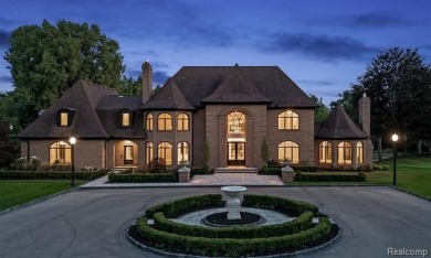 Set on over two acres along the coveted shores of all-sports on Orchard Lake Country Club in Michigan - for sale on GolfHomes.com, golf home, golf lot