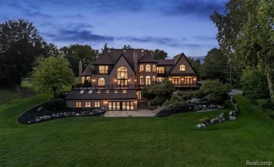 Set on over two acres along the coveted shores of all-sports on Orchard Lake Country Club in Michigan - for sale on GolfHomes.com, golf home, golf lot