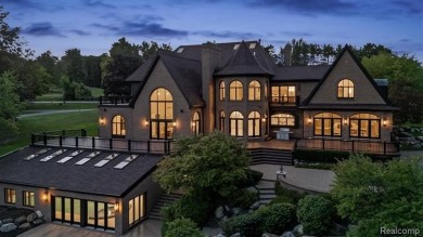 Set on over two acres along the coveted shores of all-sports on Orchard Lake Country Club in Michigan - for sale on GolfHomes.com, golf home, golf lot