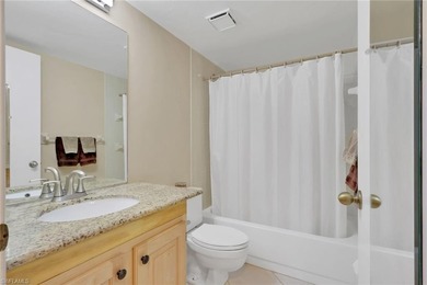 This well-appointed first-floor condo has stunning lake views on Riviera Golf Club in Florida - for sale on GolfHomes.com, golf home, golf lot