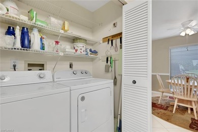 This well-appointed first-floor condo has stunning lake views on Riviera Golf Club in Florida - for sale on GolfHomes.com, golf home, golf lot