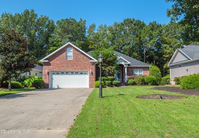 Welcome to this charming brick-front home tucked inside the on Brunswick Plantation and Golf Resorts in North Carolina - for sale on GolfHomes.com, golf home, golf lot
